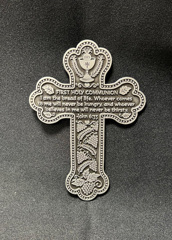 A silver pewter First Holy Communion message cross with biblical verses inscribed, hand-polished and brightly finished, including a hanging metal notch.