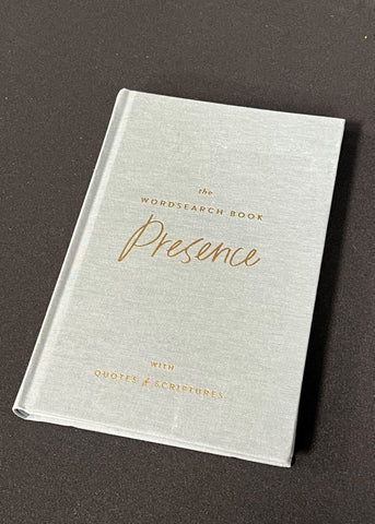 A book titled 'The Wordsearch Book: Presence with Quotes & Scriptures' by Margot Groner, with a gray cloth cover and gold foil lettering.